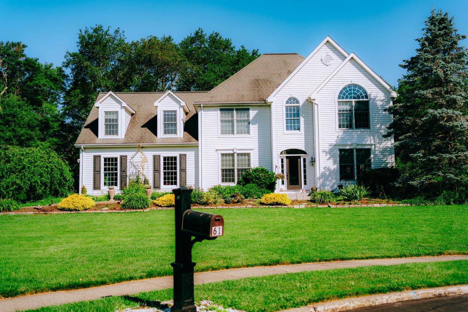Highlands Ranch two-story home exterior with manicured lawn